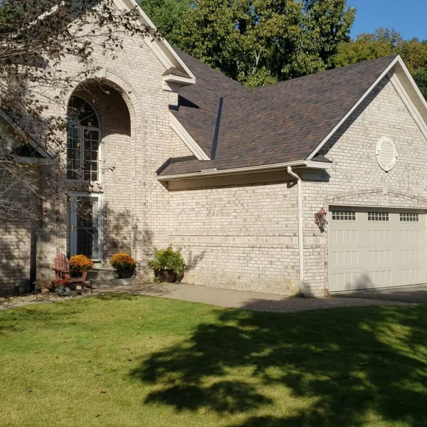 Brick house with landscaped yard